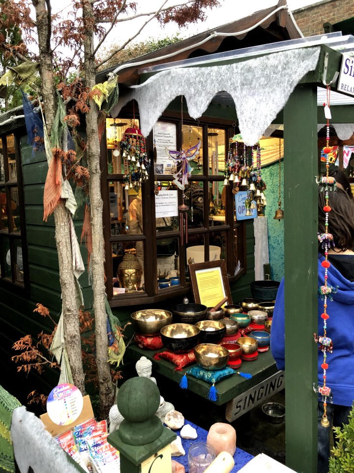 photo of small paved pathway between huts in a quaint shopping area