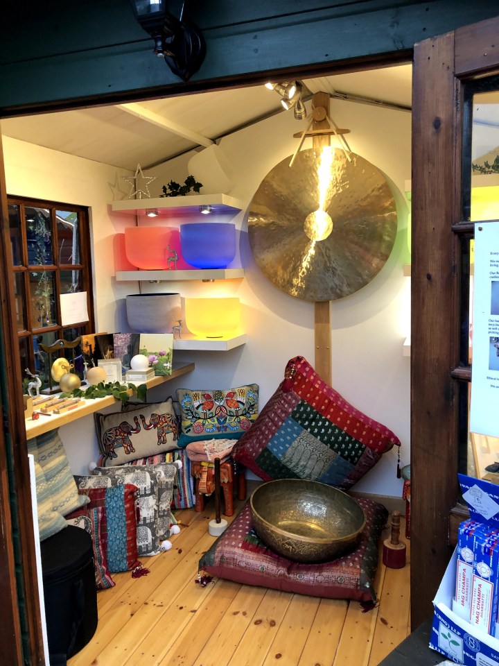 photo of small paved pathway between huts in a quaint shopping area