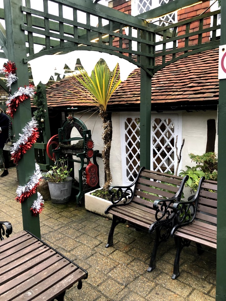 photo of small paved pathway between huts in a quaint shopping area